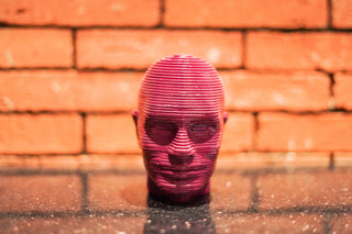 ABSTRACT MUTLILAYERED FACE  STATUE